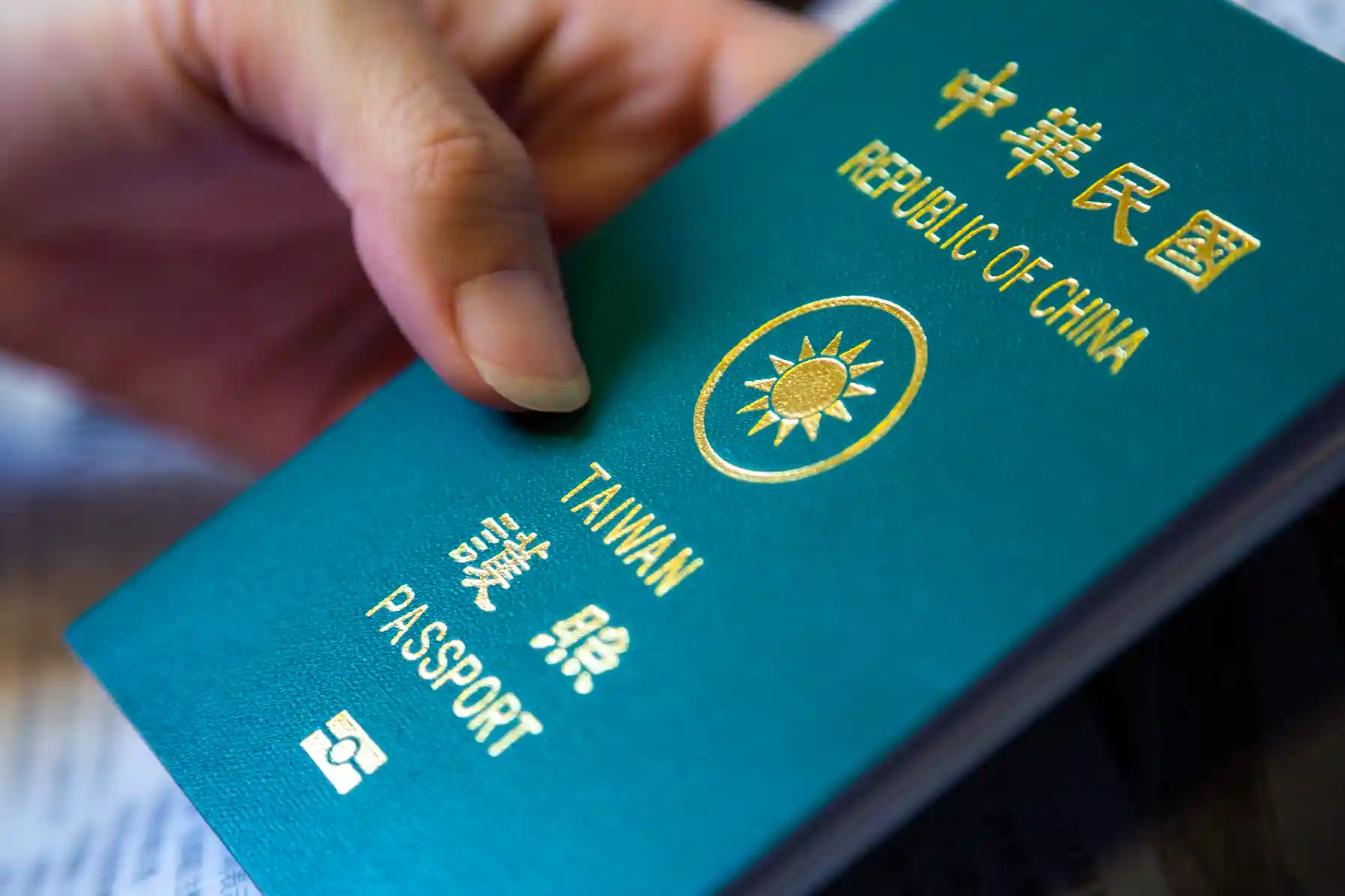 close-up-of-smiling-woman-handing-approved-visa